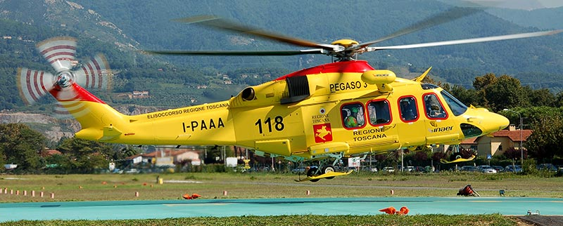 AW139 medical helicopter over the Tuscan countryside near Florence, Italy