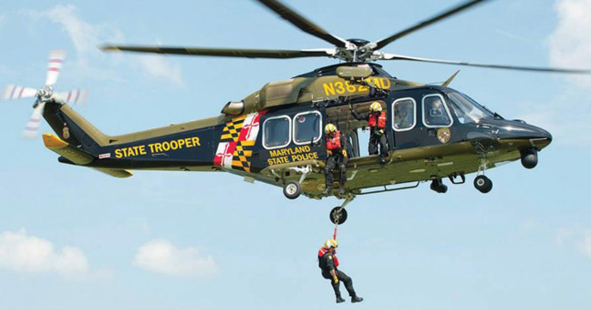 Maryland State Police helicopter N381MD conducting a hoist rescue with a crew member suspended below