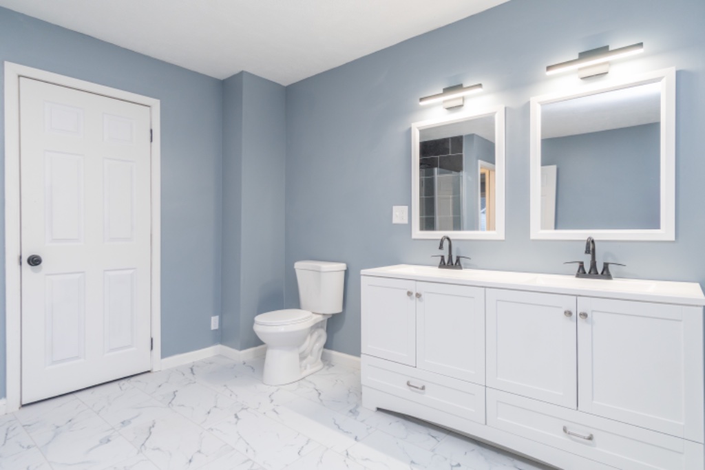 Double-Sink Vanity with Matte Black Fixtures and Marble Flooring