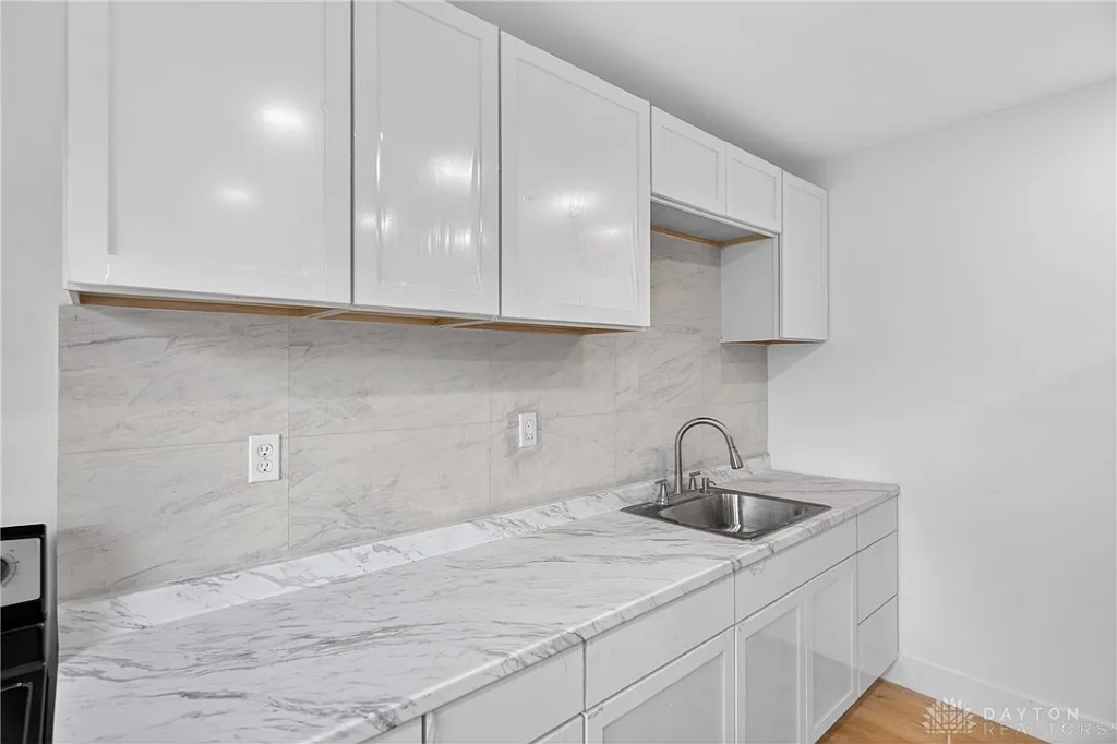 Kitchen Workspace with Marble Counters and Undermount Sink