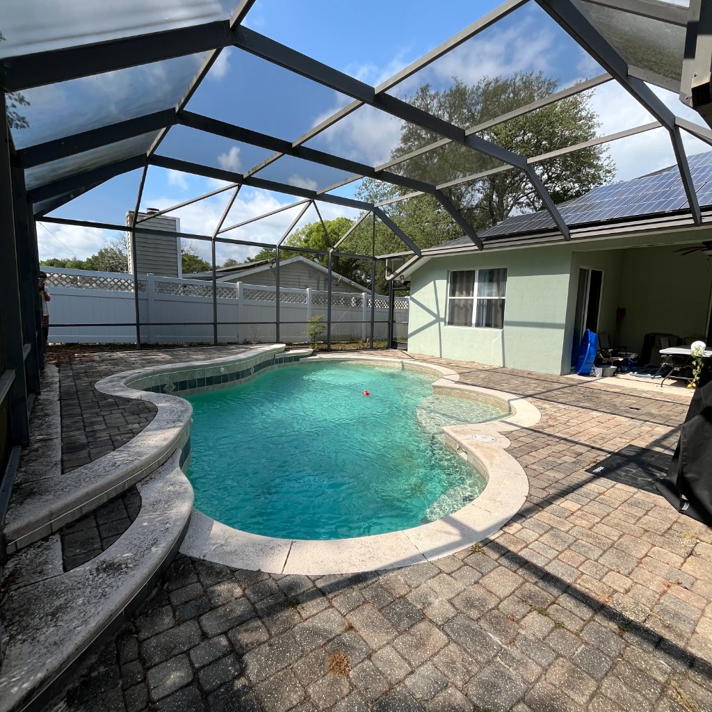 Pool cage screen repair on single story Florida home
