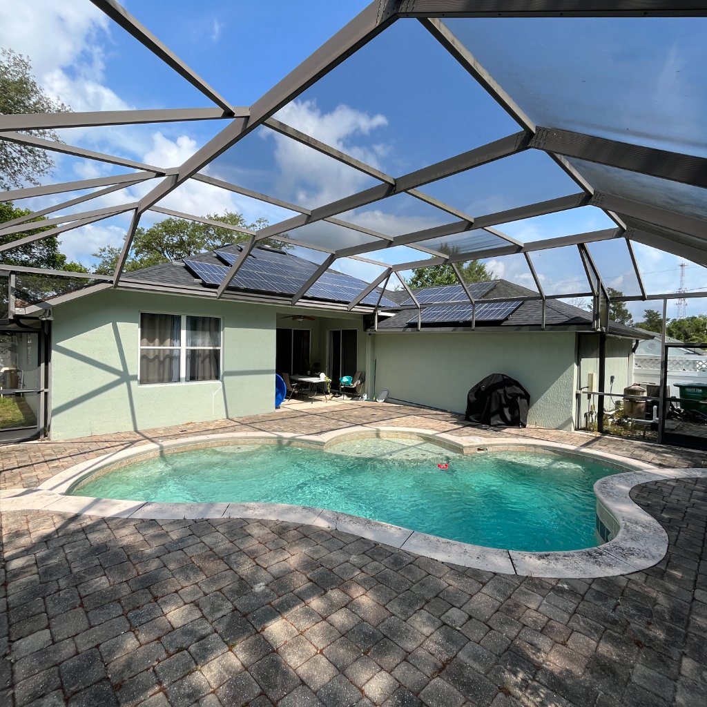 Pool screen enclosure with clean panels over swimming pool in Florida