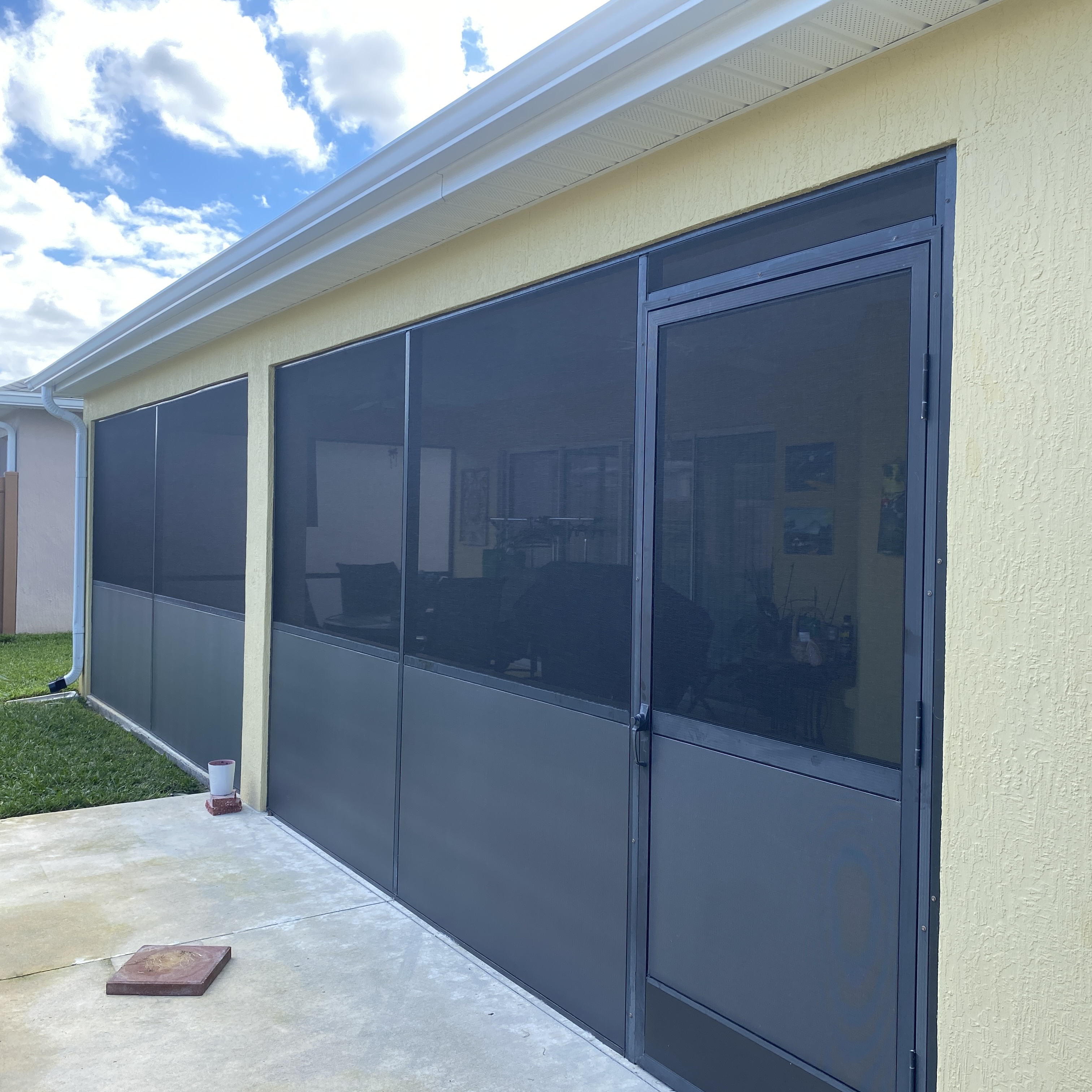 Screened porch with privacy screen panels installed
