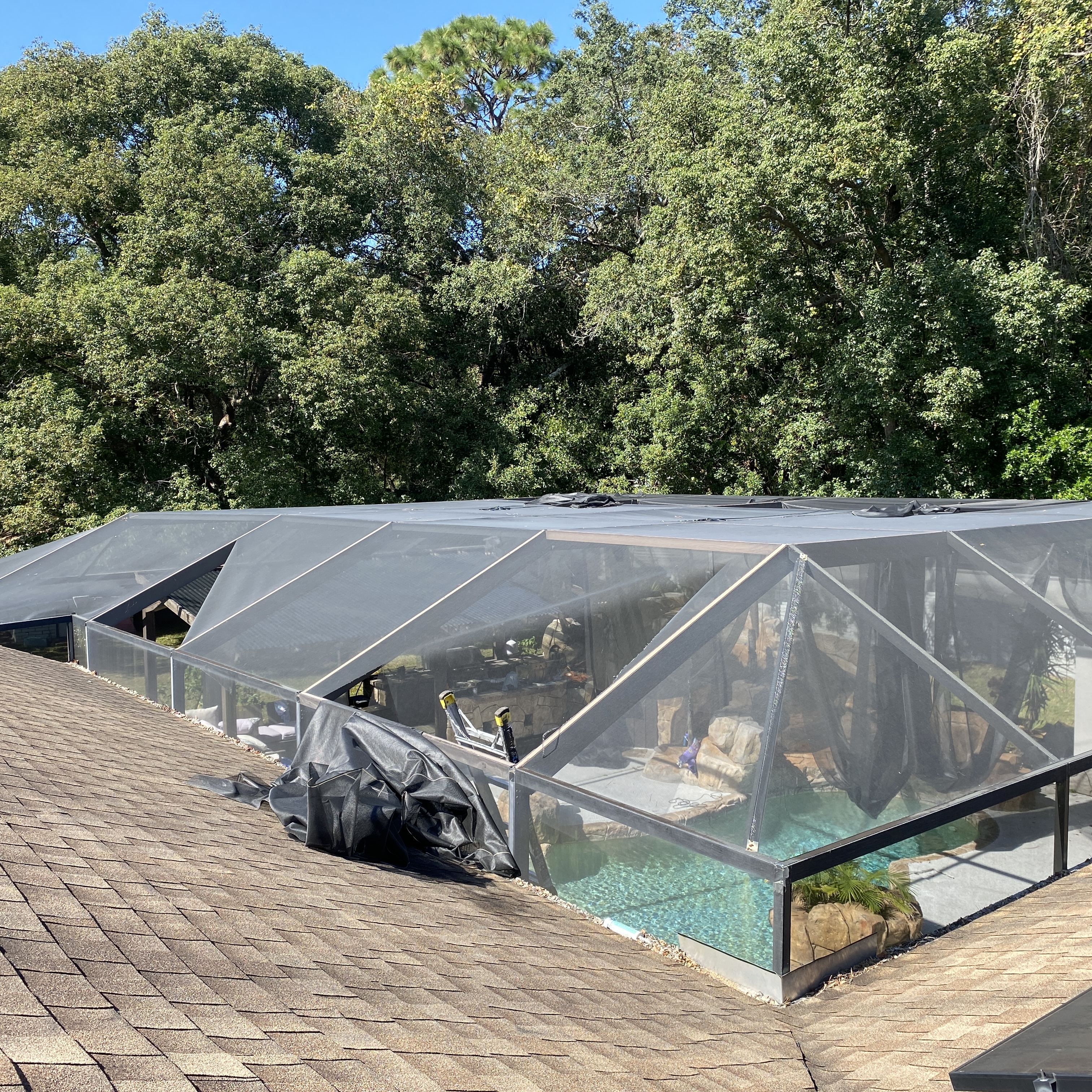 Overhead screen panels on a pool enclosure — example for pool, patio, porch and lanai screen repair service in Oakland, FL
