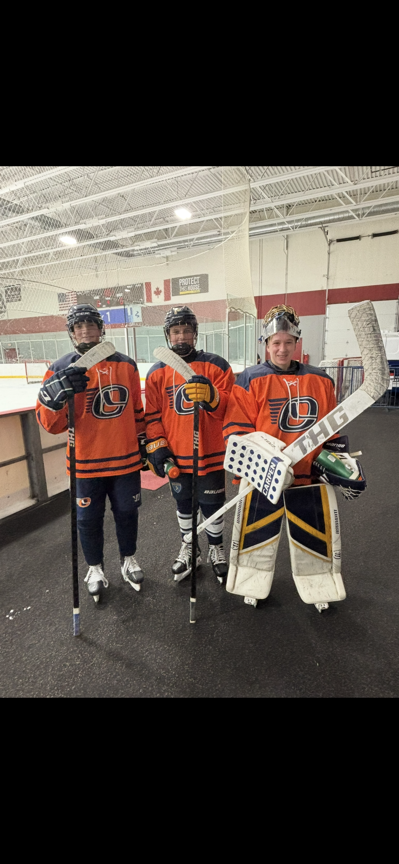 Oswego Hockey team with THG sticks