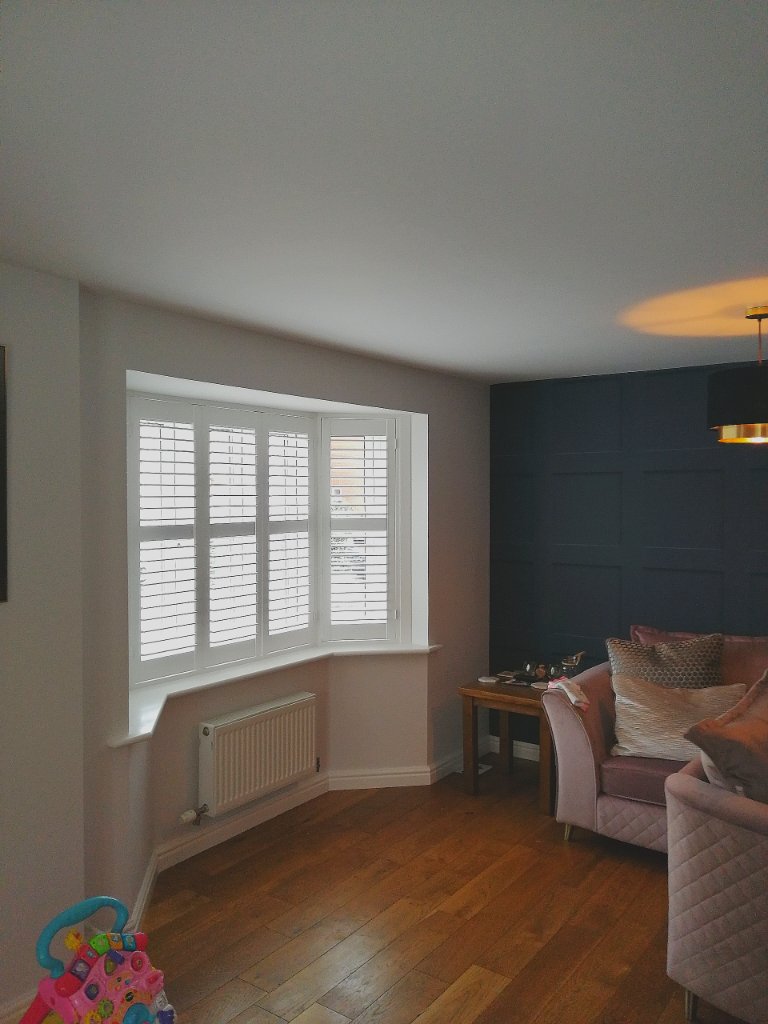 White Plantation Shutters — Bay Window