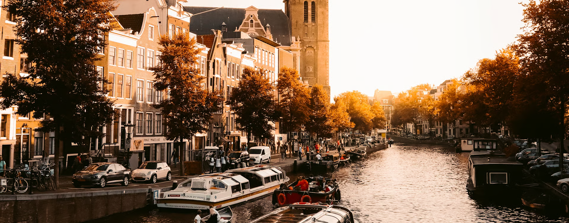 Amsterdam canal with boats and historic buildings