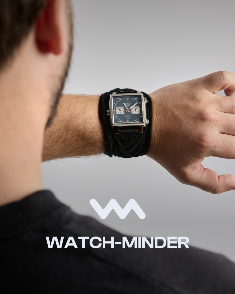 A TAG Heuer Monaco watch protected by a black WATCH-MINDER™ merino wool band on the wearer's wrist