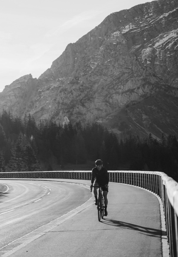 Cyclist wearing a WATCH-MINDER™ merino wool watch protection band