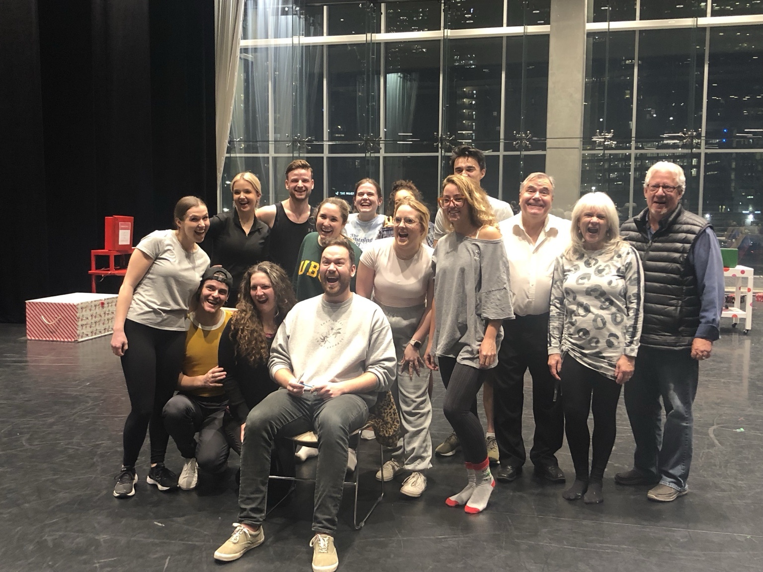 Cast and crew group photo on stage