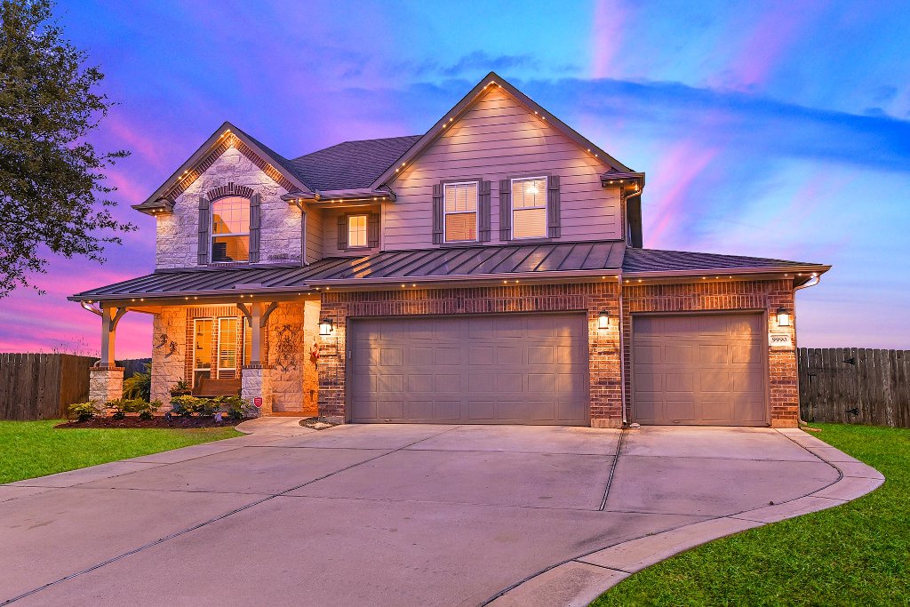 Permanent smart lighting on luxury home with dramatic sunset sky