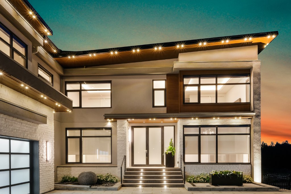 Premium Central Oregon home with architectural LED roofline lighting at dusk