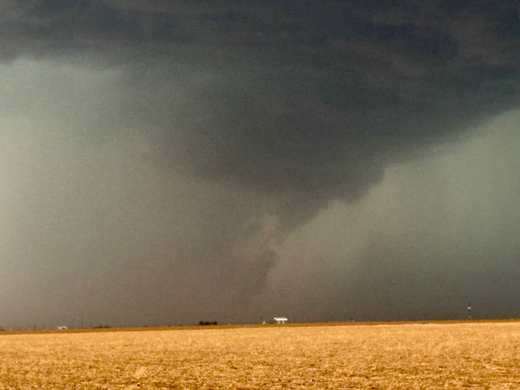 Rain-wrapped tornado at close range