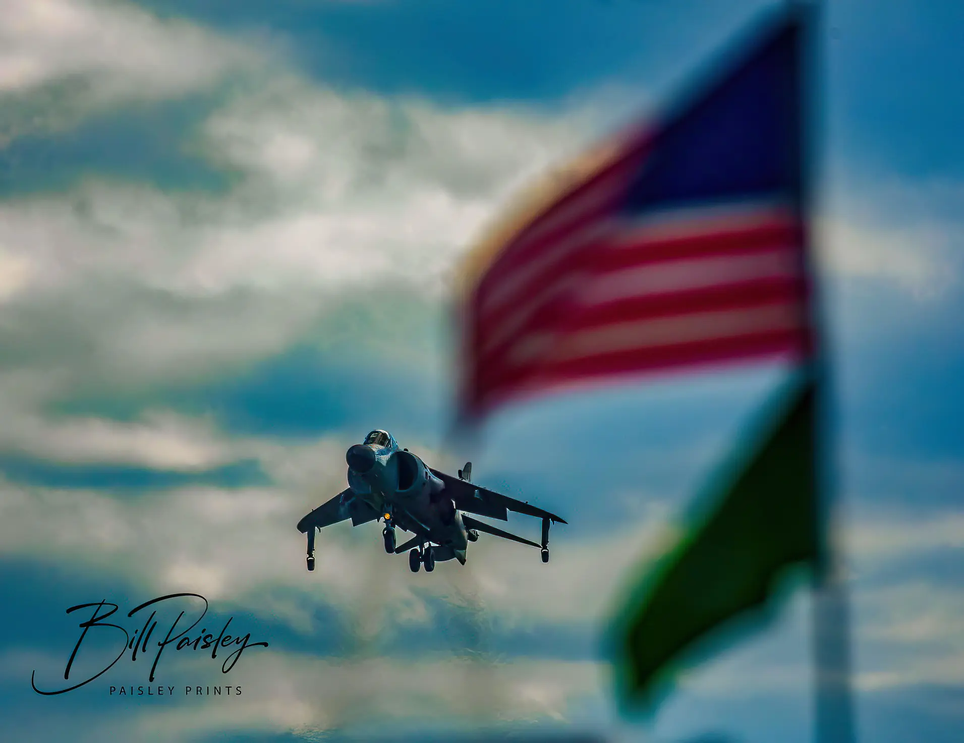 Harrier jet alongside the American flag