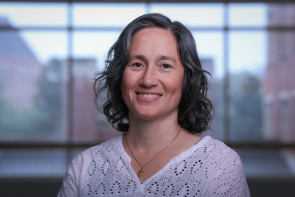 PHOTO: Emily Moriarty Lemmon — professional portrait, outdoors in field or in lab setting. Vertical/portrait orientation.