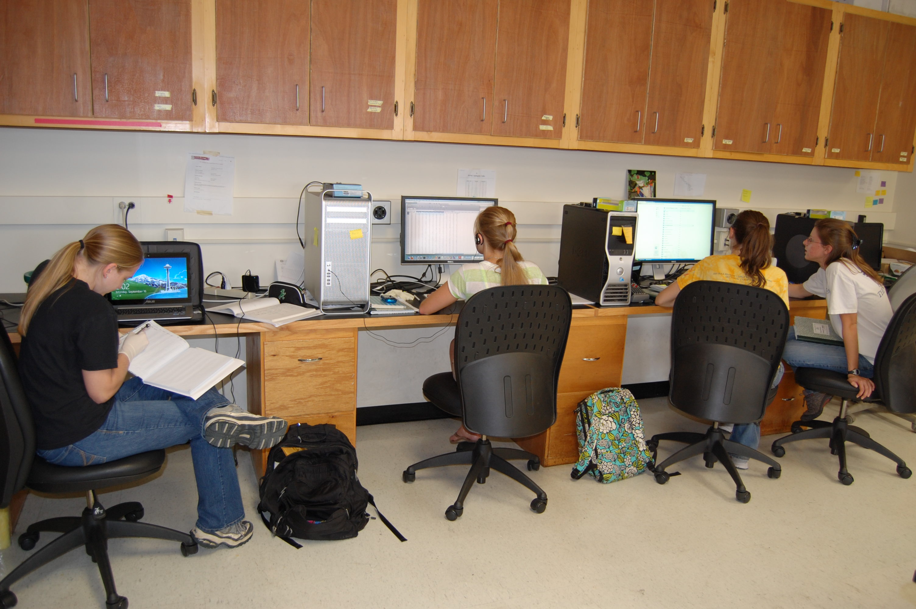 Undergraduates working at the lab computer station