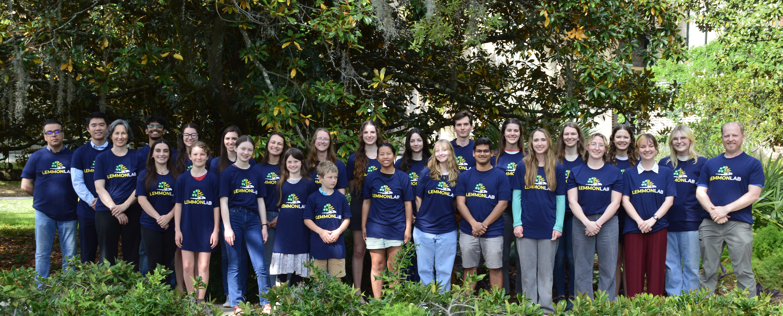 PHOTO: Alumni banner — group photo from a past field season or lab gathering.