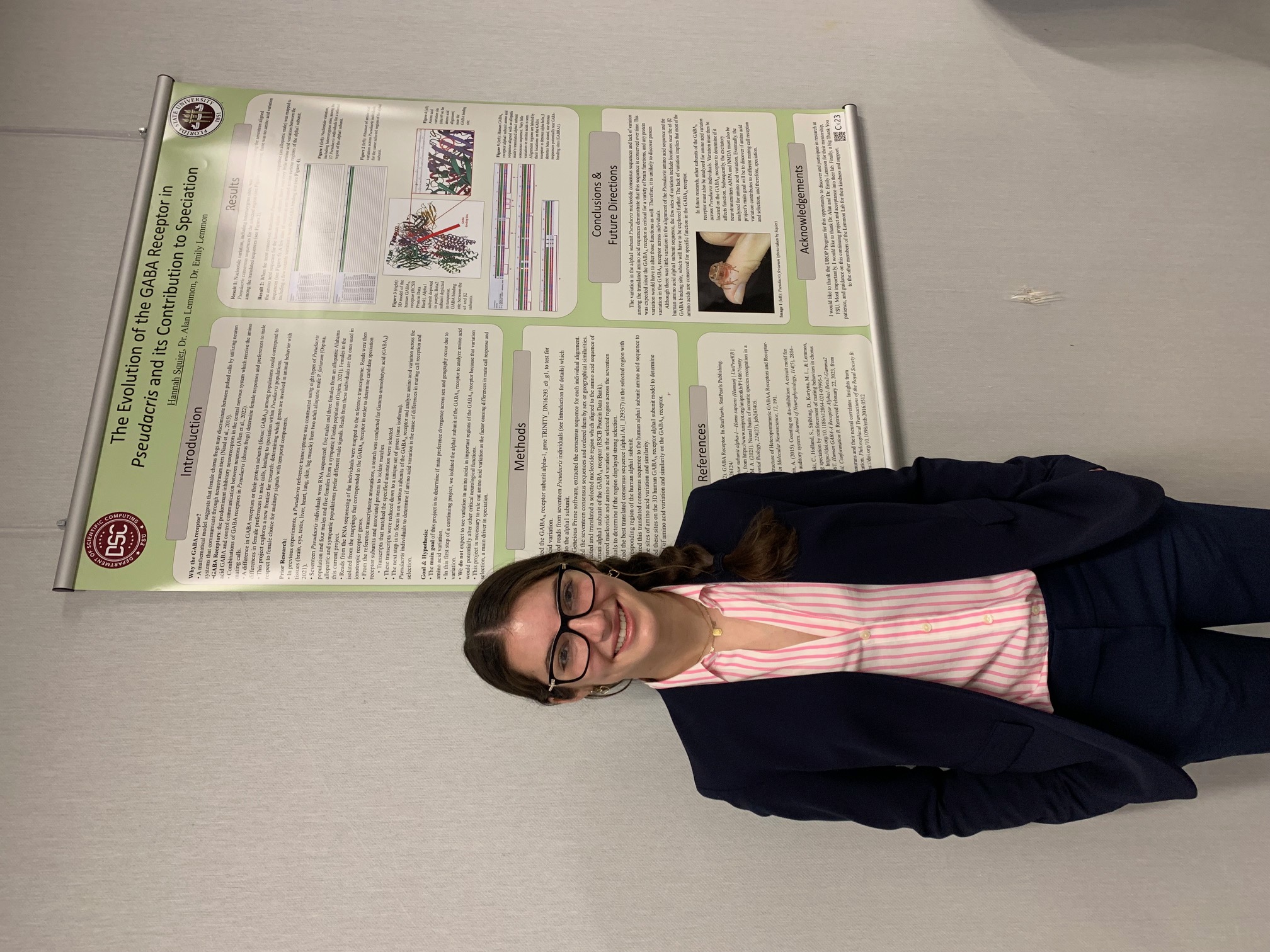 Hannah Squier with her research poster on GABA receptor evolution