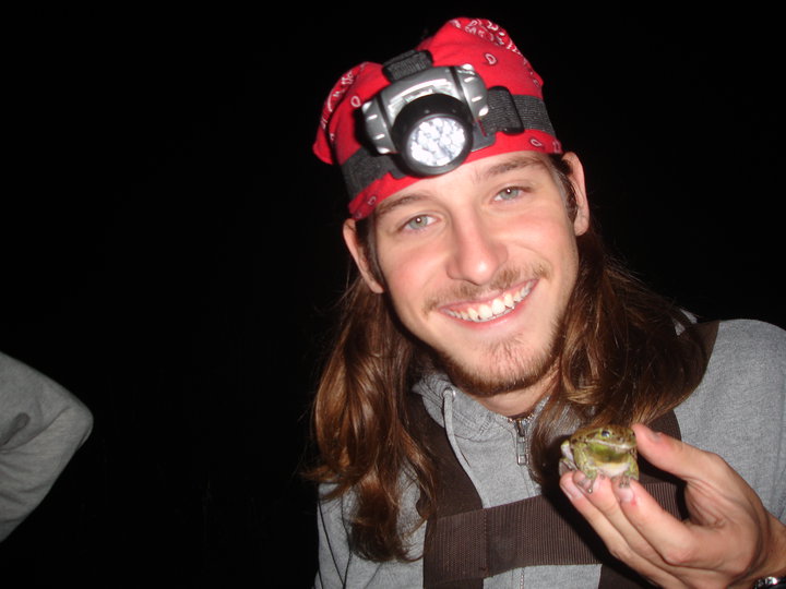 Miguel Mejias, fieldwork at night with a frog