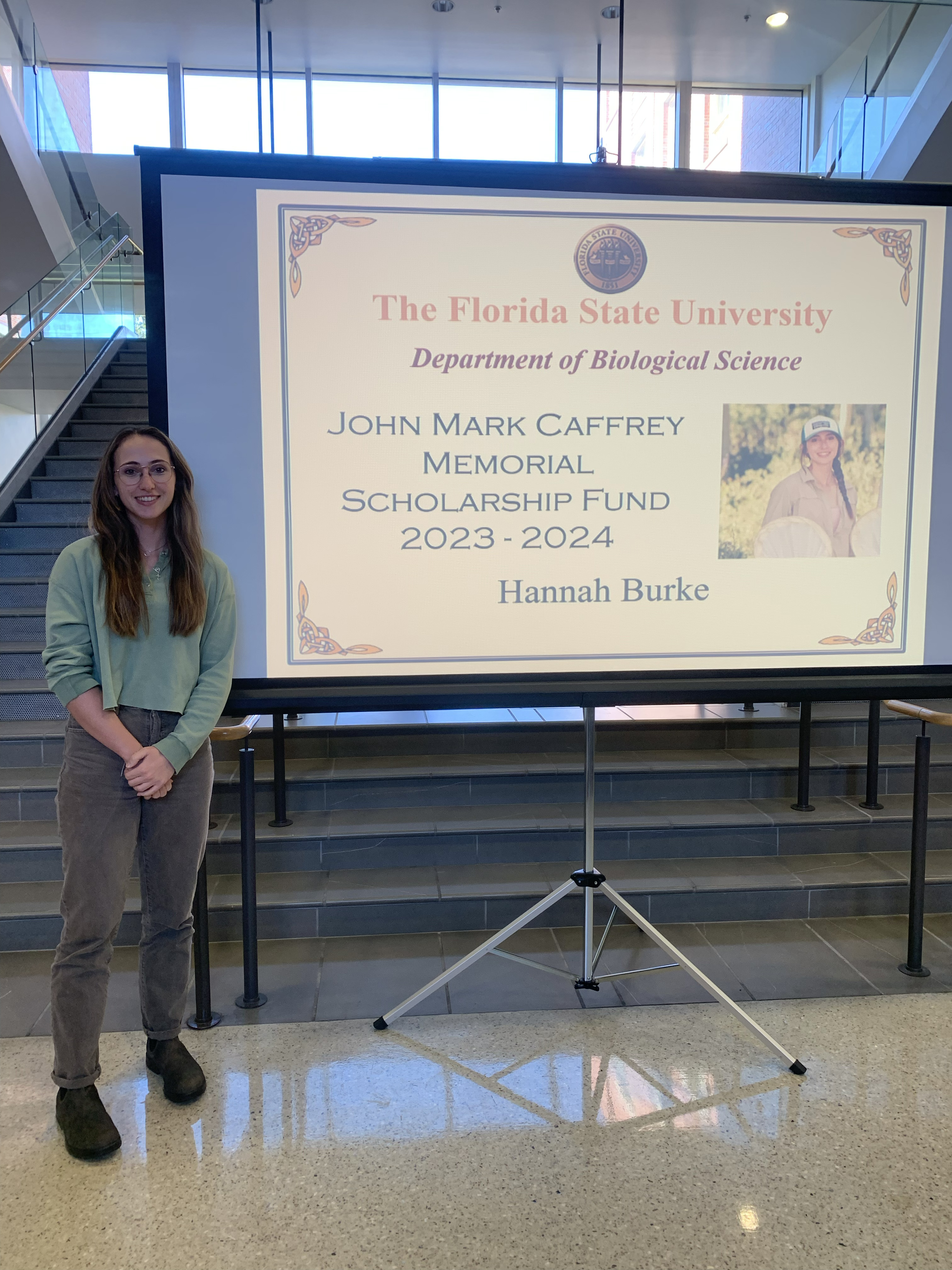 Hannah Burke receiving the John Mark Caffrey Memorial Scholarship, Fall 2023