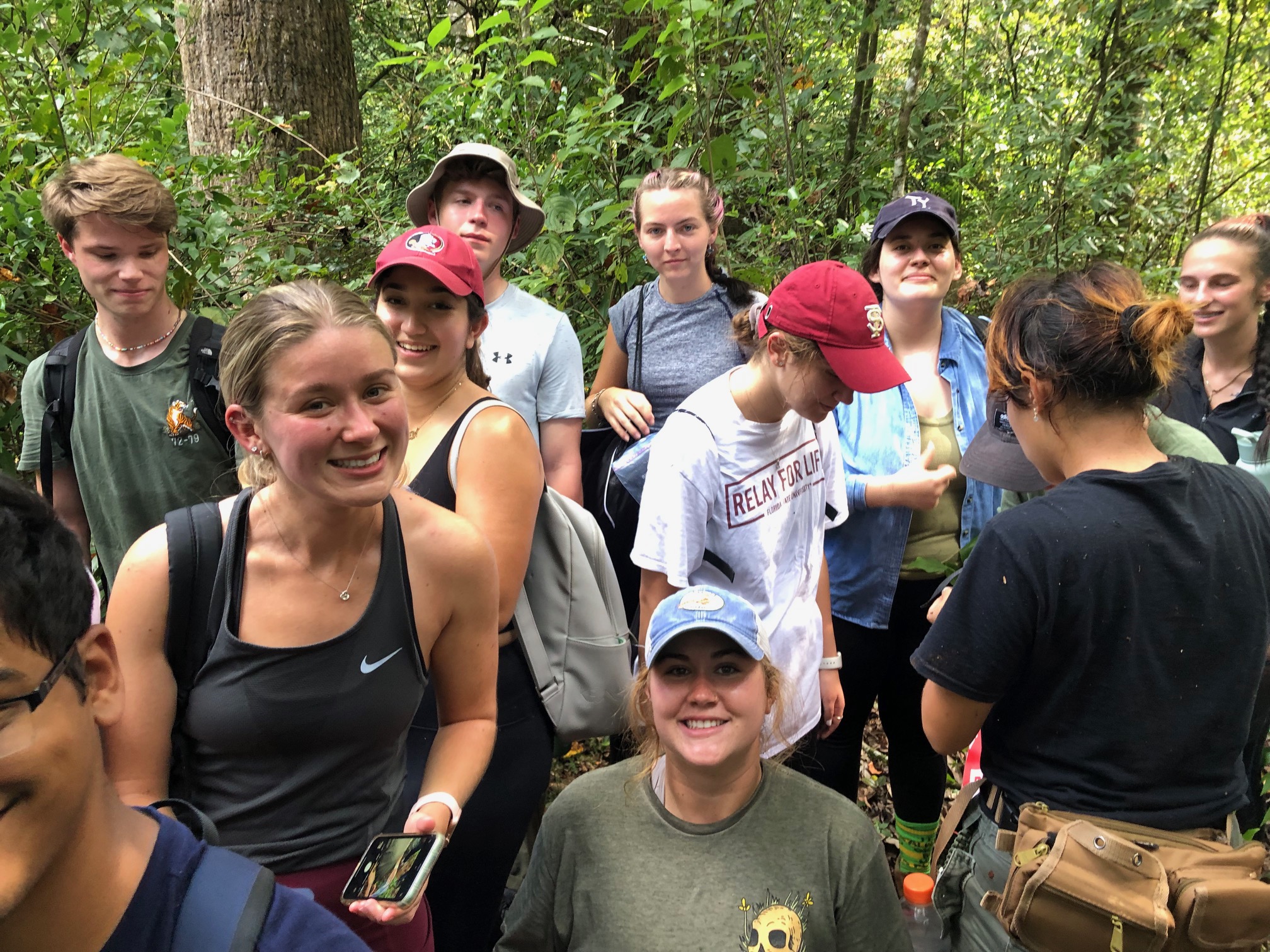 Field course students gathered in the woods