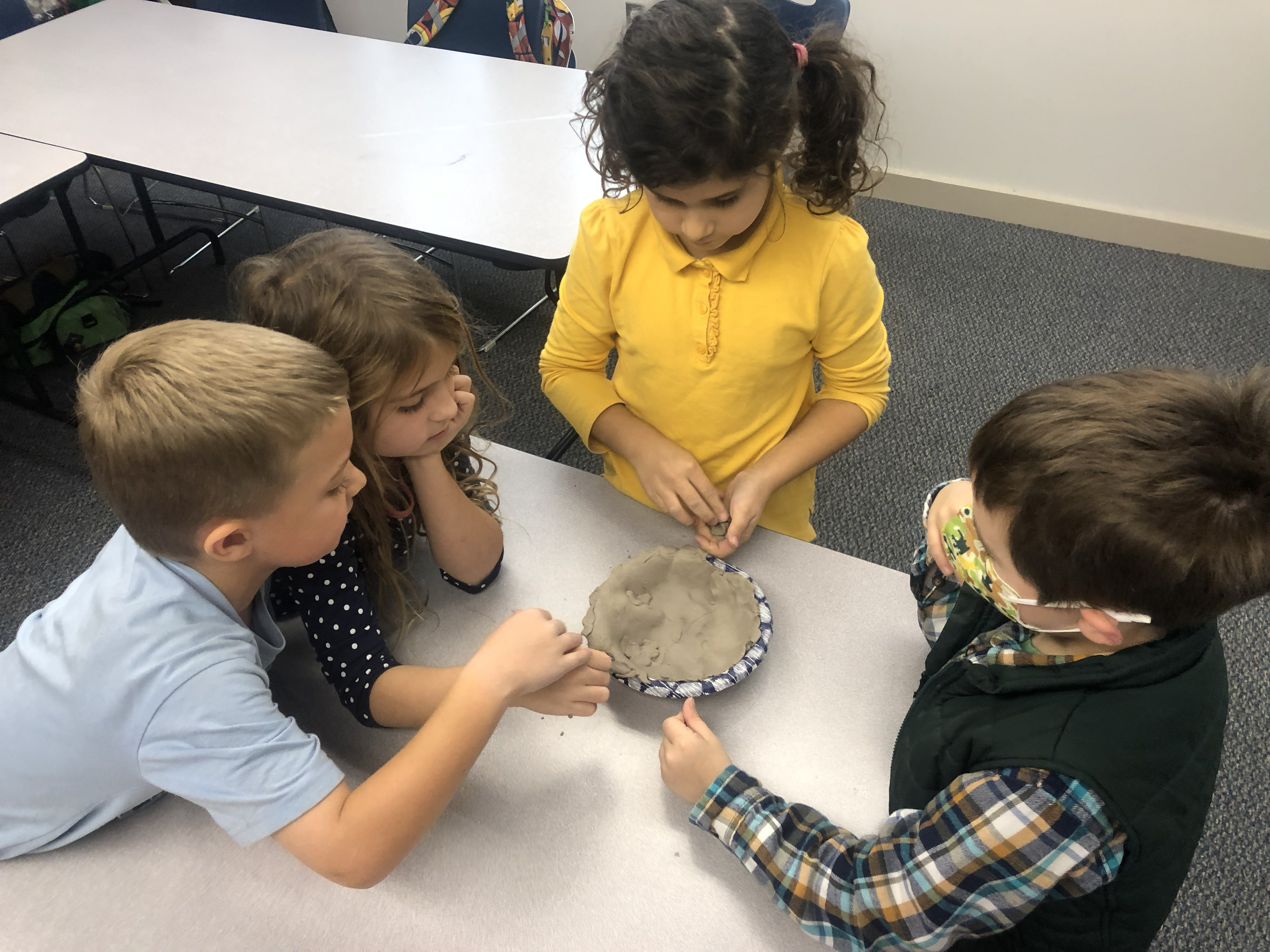Outreach: Sculpting clay together