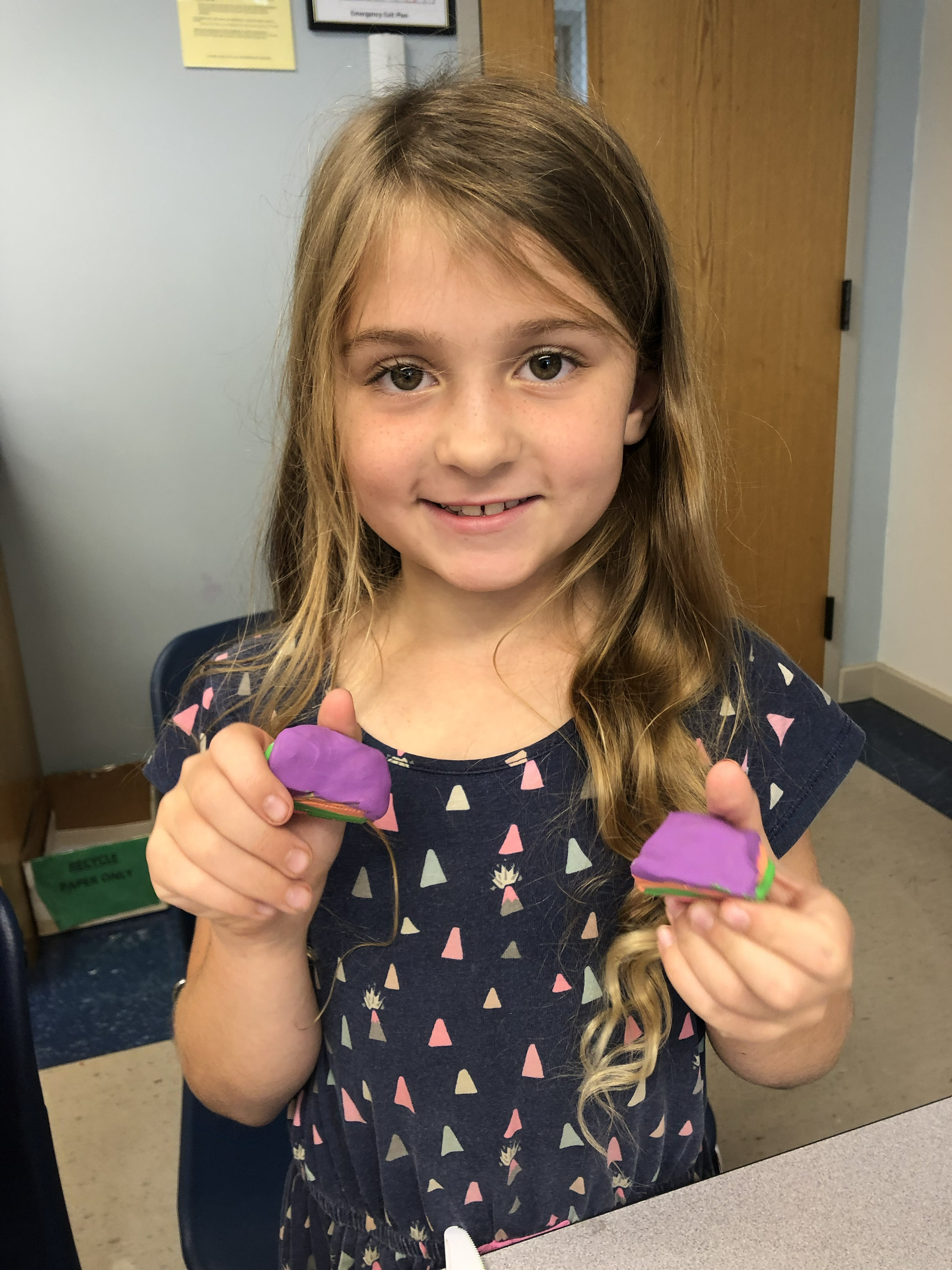 Outreach: Displaying purple clay pieces