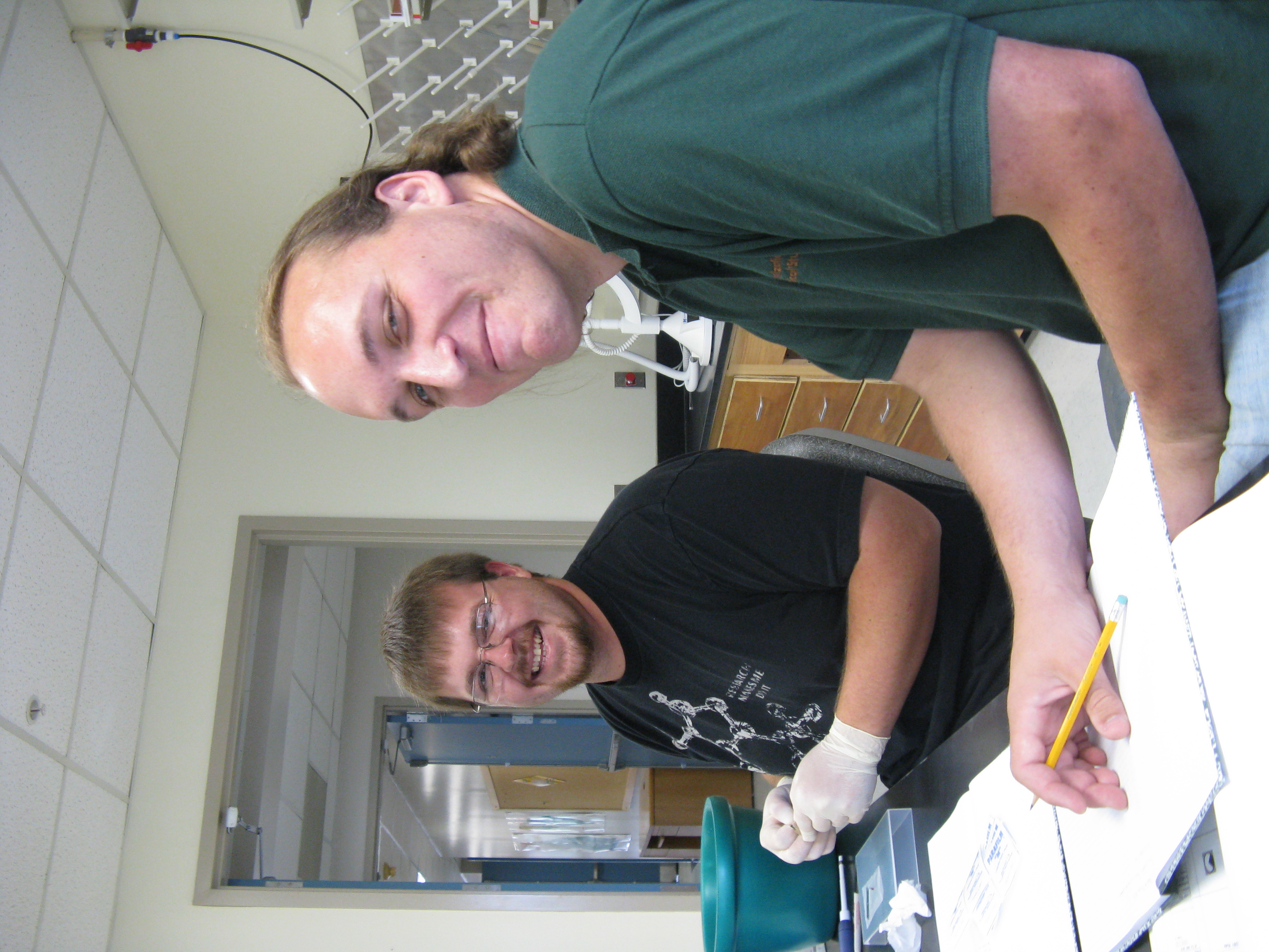 Moses Michelsohn and Brian Caudle working at a lab bench