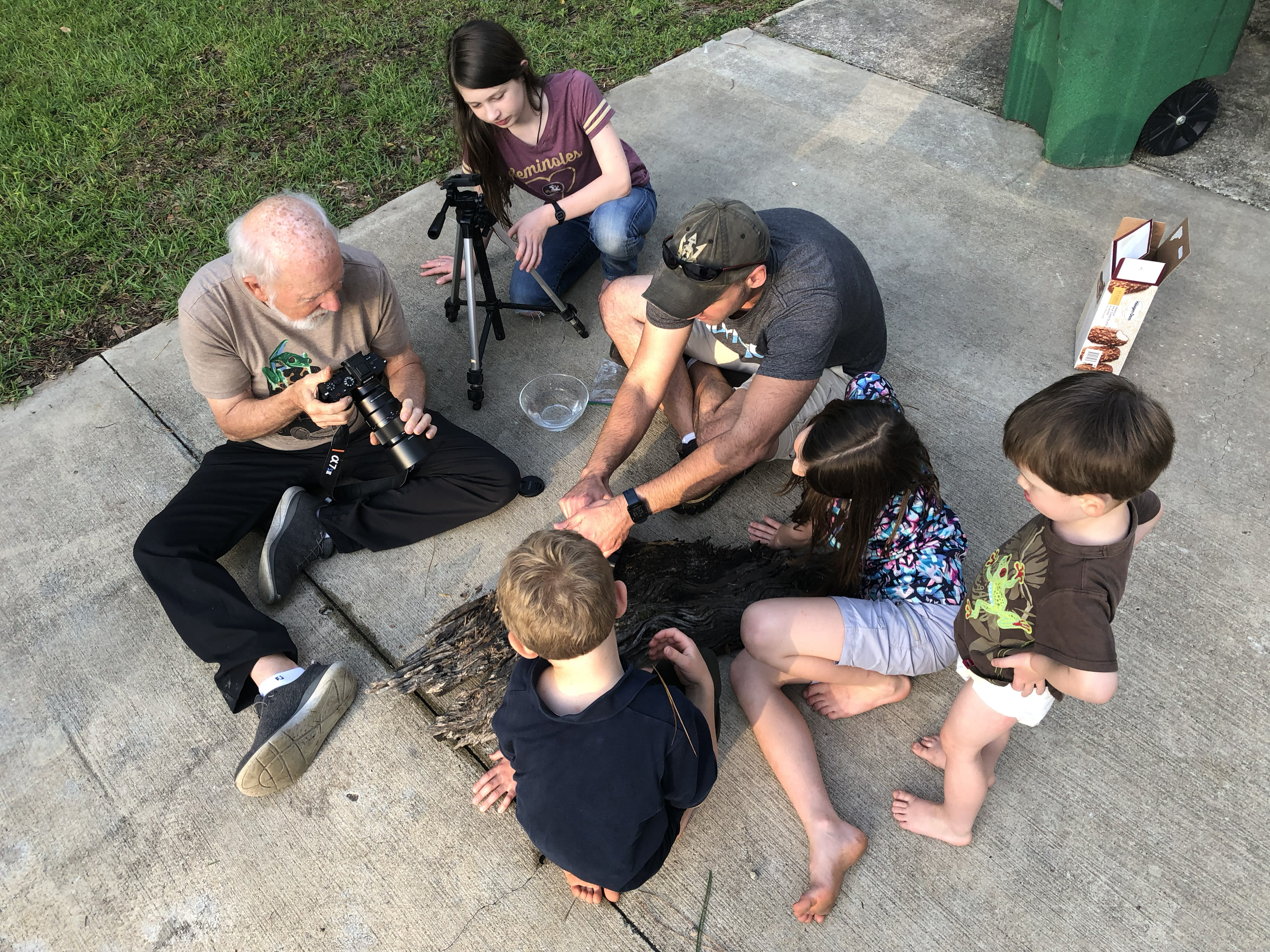 Outreach: Examining driftwood and specimens together