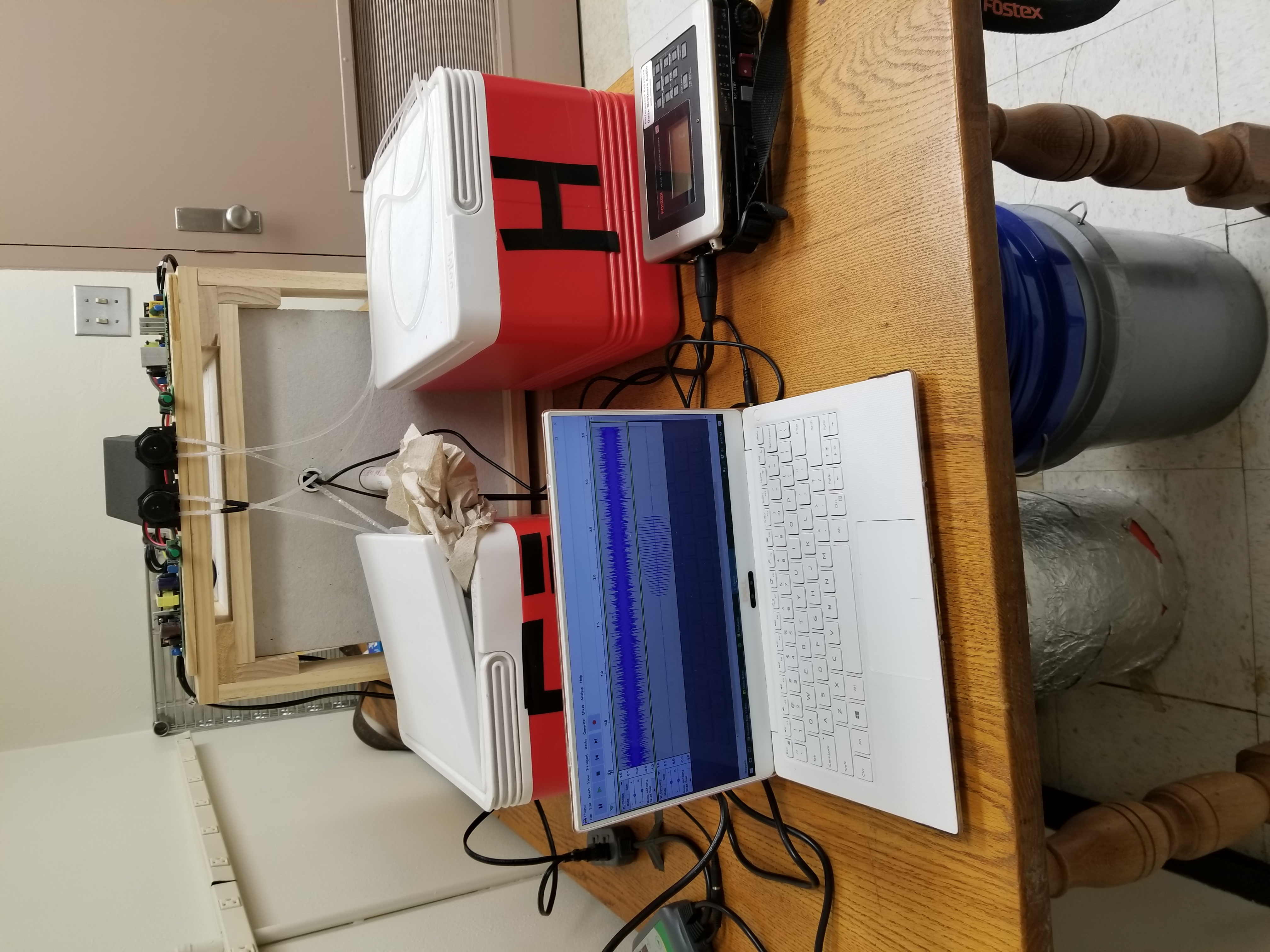 Frog box setup with laptop, coolers, and audio recorder