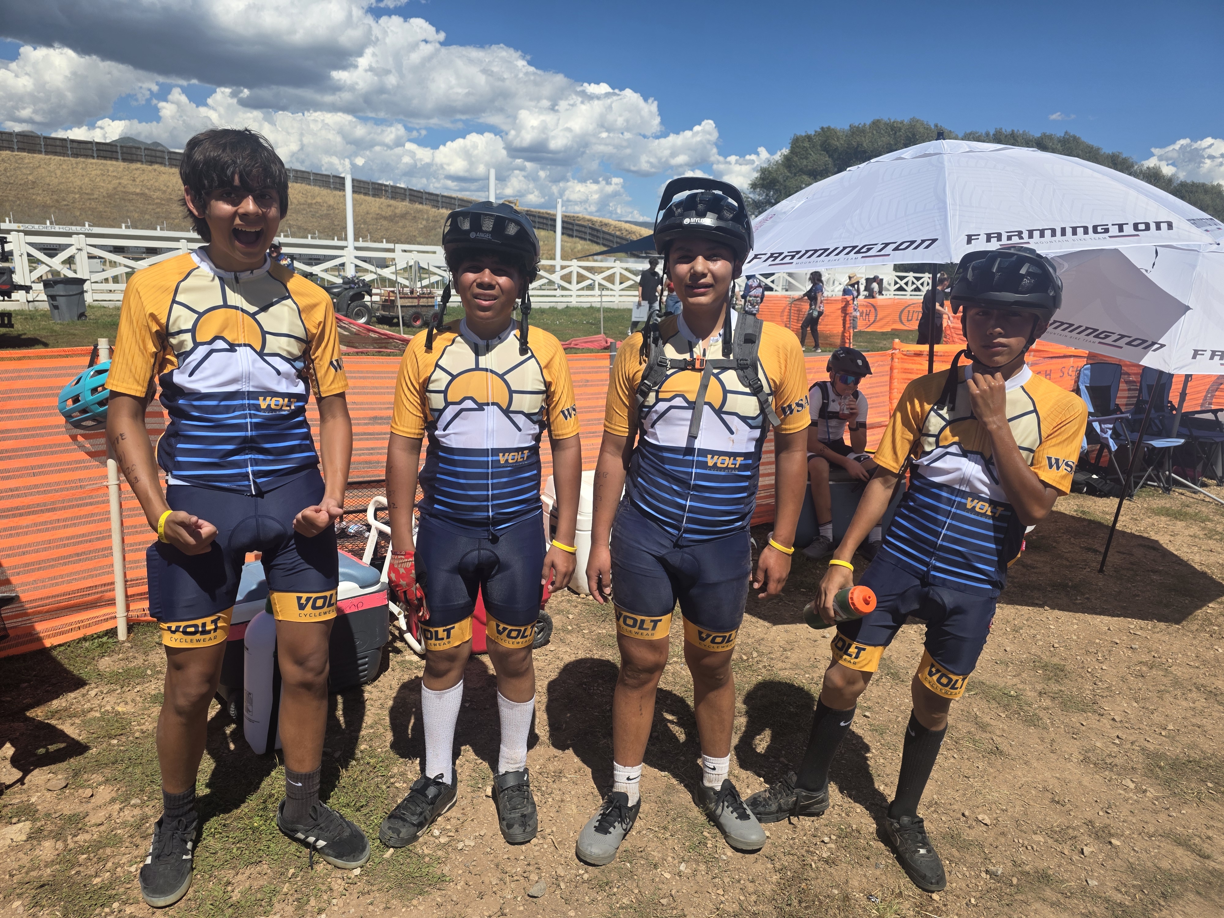 Four teammates in matching WSA jerseys on the dirt path