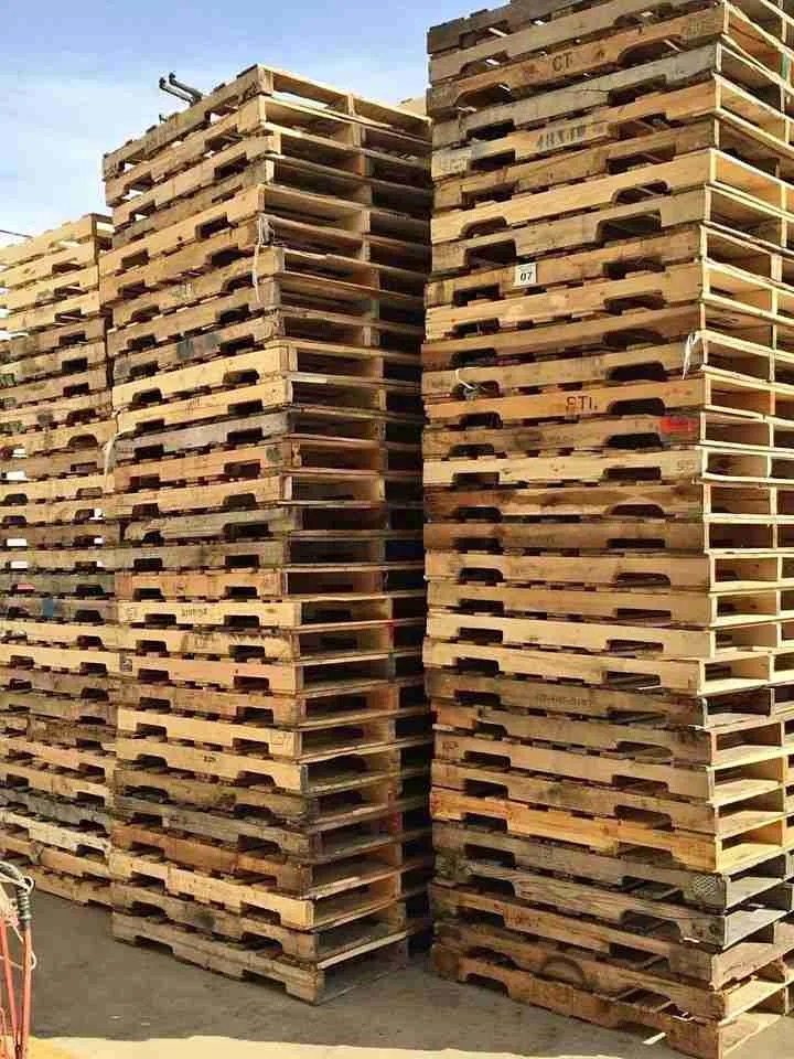 Stacked wooden pallets ready for marketplace trading