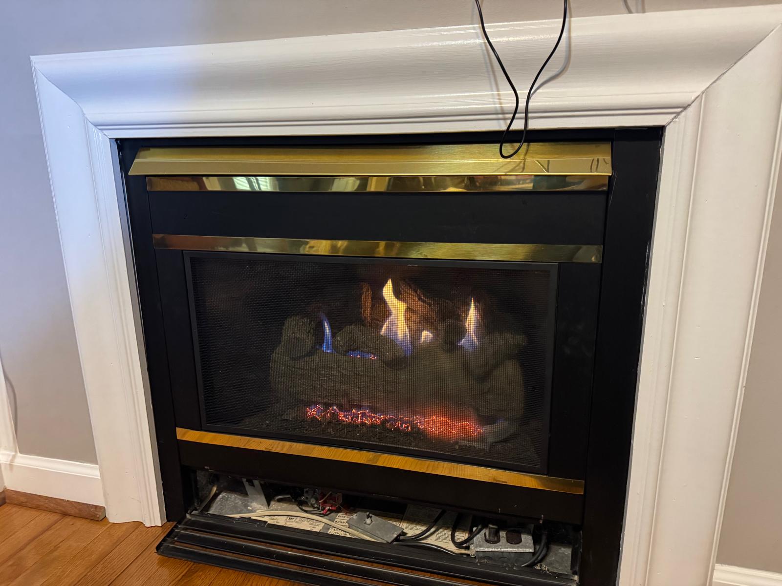 Real gas fireplace log set in a Woodbridge Virginia home