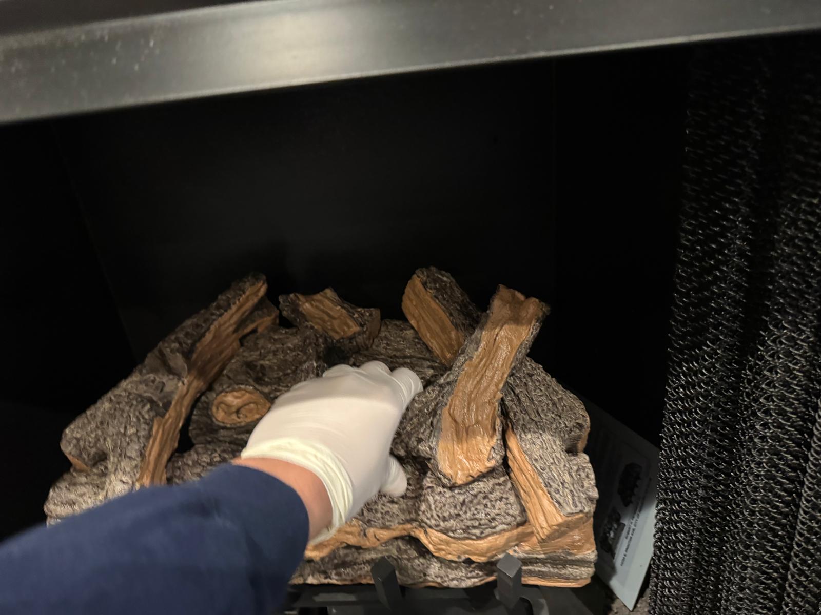 Real gas fireplace with glowing embers in an Annandale Virginia home