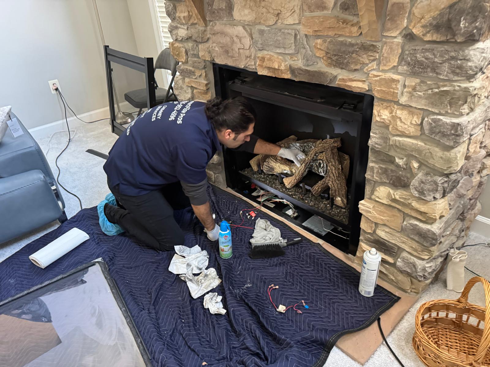 Real gas fireplace log set with flame in a Bethesda Maryland home