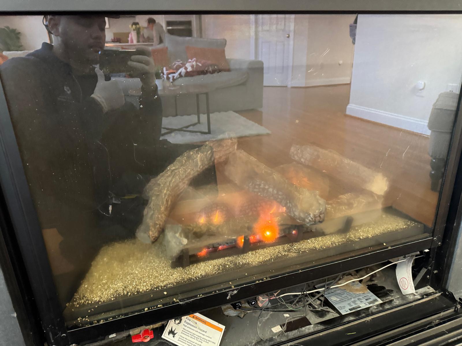 Real gas fireplace in a Vienna Virginia home with marble mantle