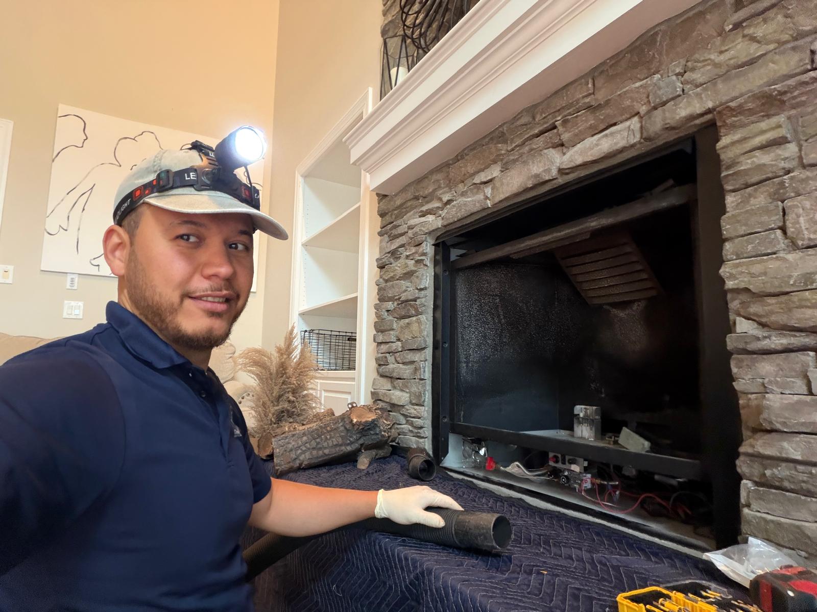 John Ab — Capital Gas Fireplace Repair technician servicing a gas fireplace in Northern Virginia