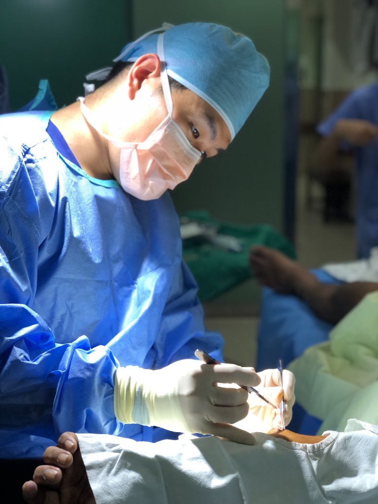 Dr. Chris Nahm performing surgery