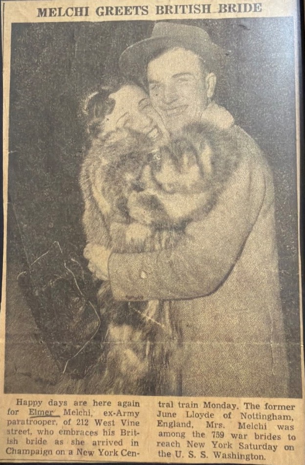 Champaign newspaper — Melchi greets British bride June on her arrival