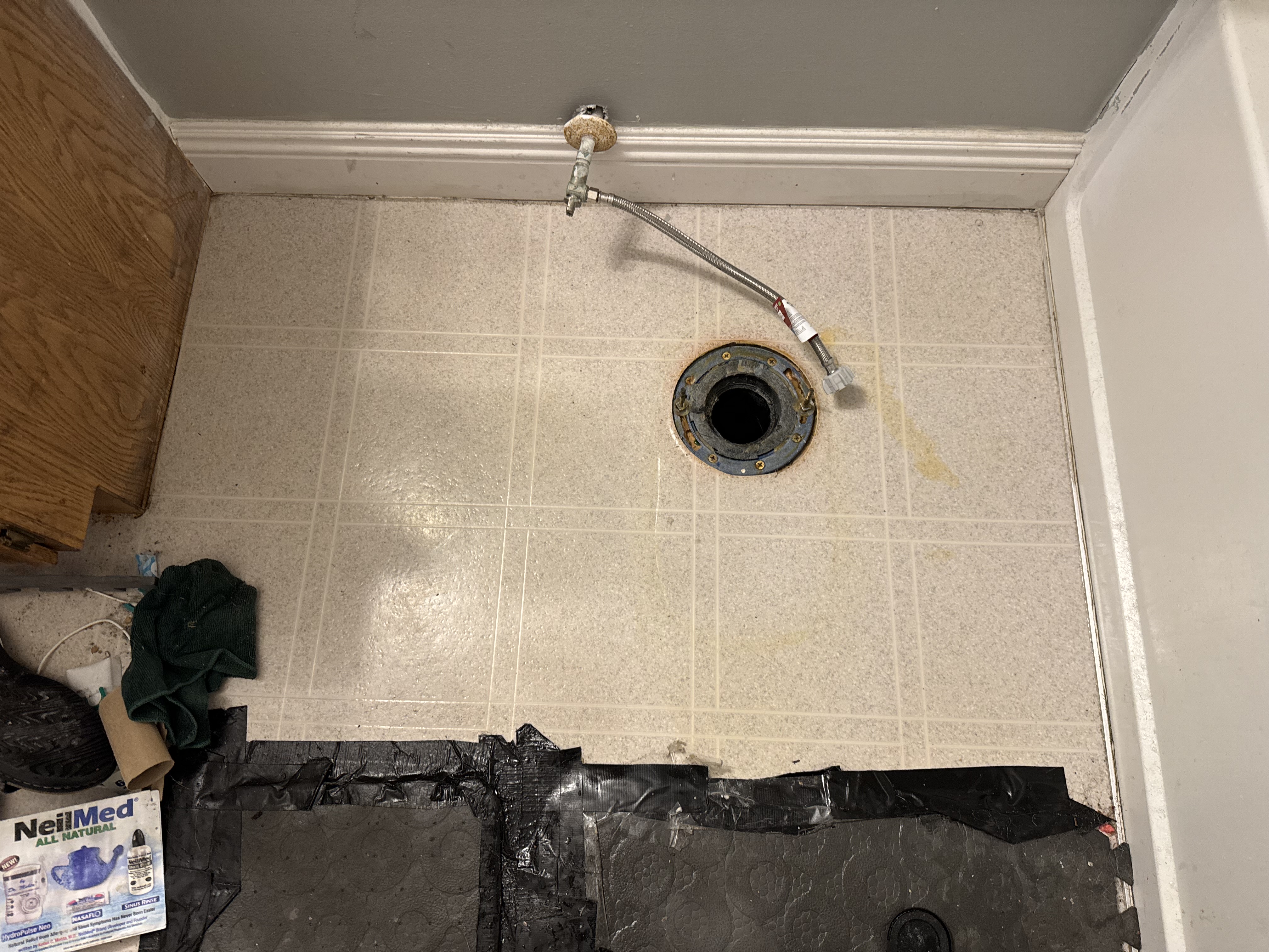Old toilet removed and floor flange exposed during a minor plumbing repair by Turnkey Property Services
