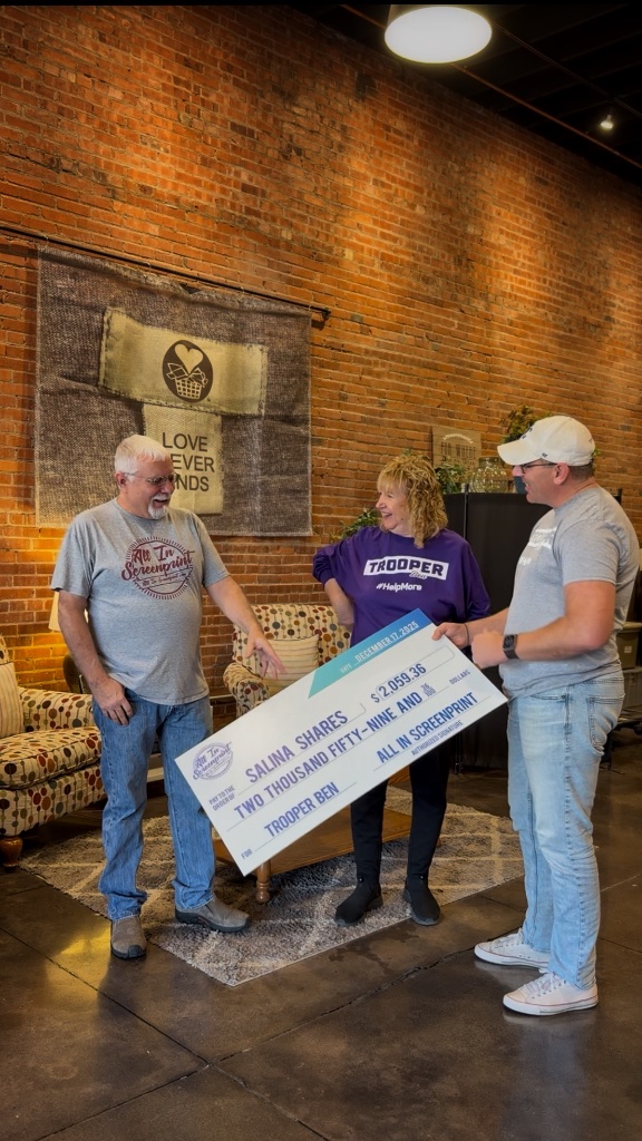 Trooper Ben donating $2,059.36 to Salina Shares, December 17, 2025