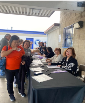 Registration volunteers greeting and checking in retreat attendees