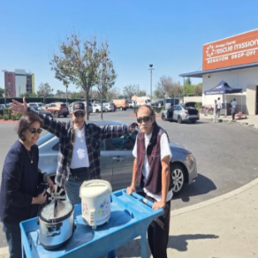 FFRGOC President Evelyn Ruiz, Eli Ruiz and Dean Miyata getting ready to bring the food for the March charity feeding at OC Rescue Mission.