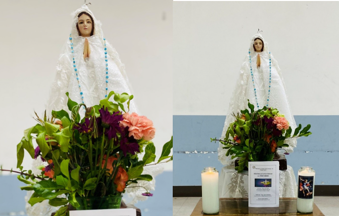 Blessed Mother Statue adorned with flowers and the 2026 Annual Lenten Retreat program