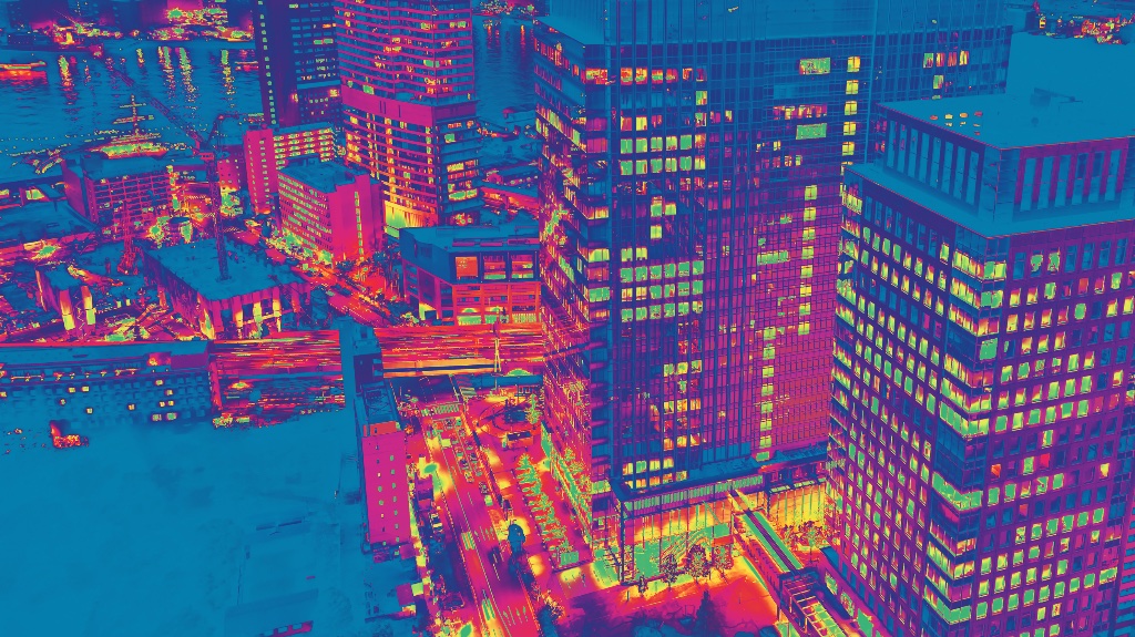 Thermal imaging aerial view of cityscape at night — Airframe thermal drones detect heat signatures in complete darkness