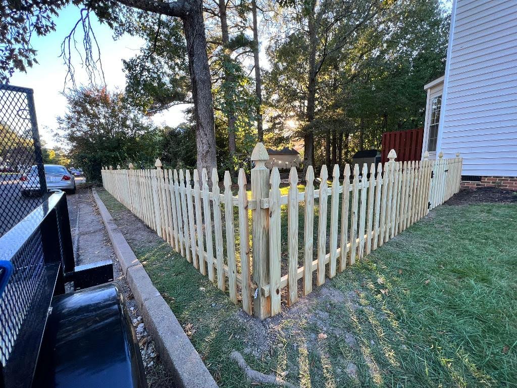 Newly installed wooden picket fence