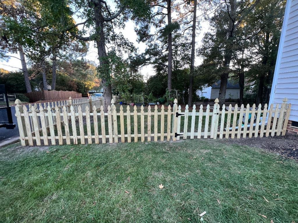 Wooden picket fence with gate