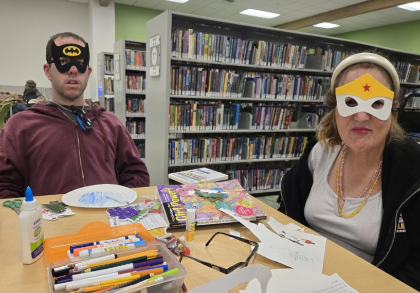 Participants making crafts together at the library