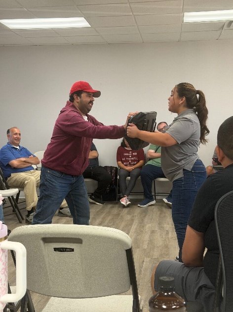 Participant practicing a boundary-setting exercise with an instructor