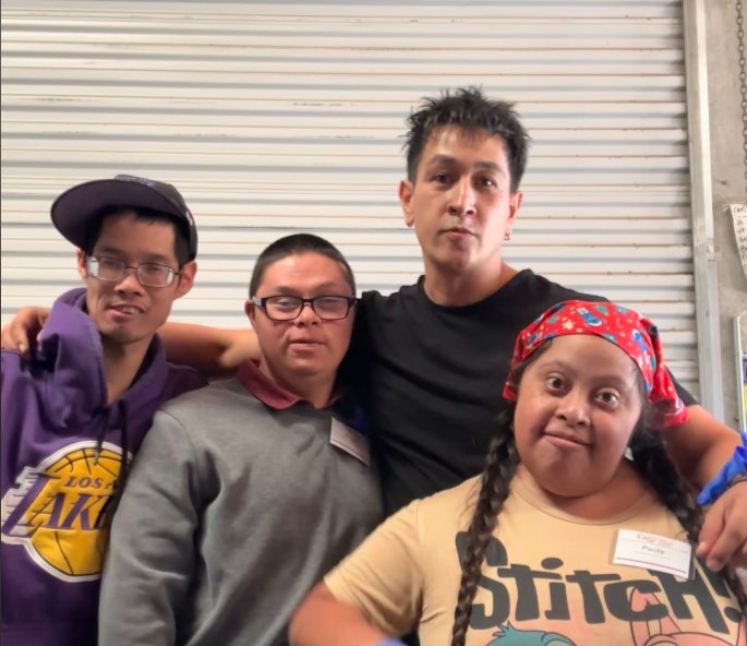 Job Coach Ivan with his group at a community volunteer site